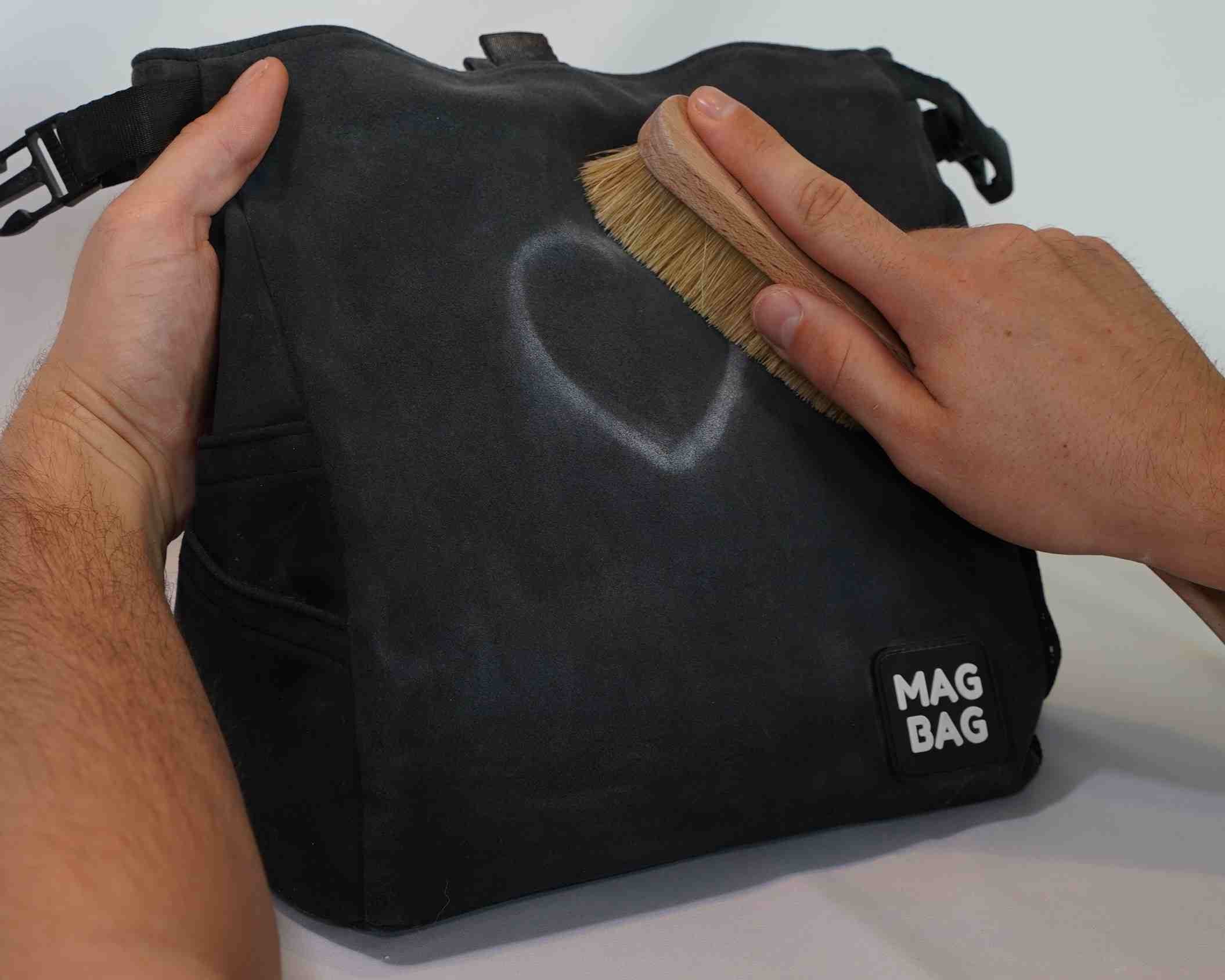 brushing chalk off the bag