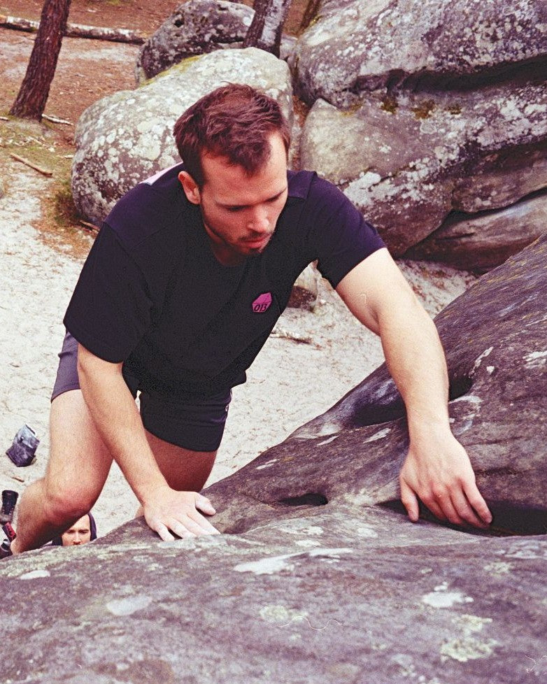 The founder of MAG BAG topping out a boulder problem on sandstone